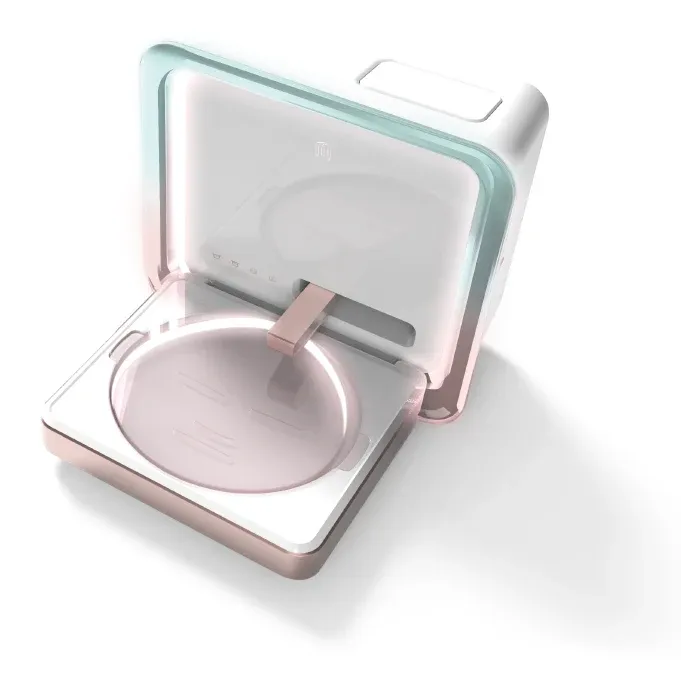 Concept rendering of the META face mask machine, lid open above the mask-forming tray